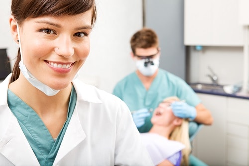 female hygienist in foreground