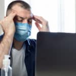 stressed man wearing mask