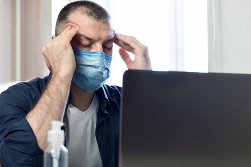 stressed man wearing mask