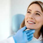 Satisfied young woman came to see the dentist.