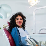 Portrait of young patient woman at dentist's office